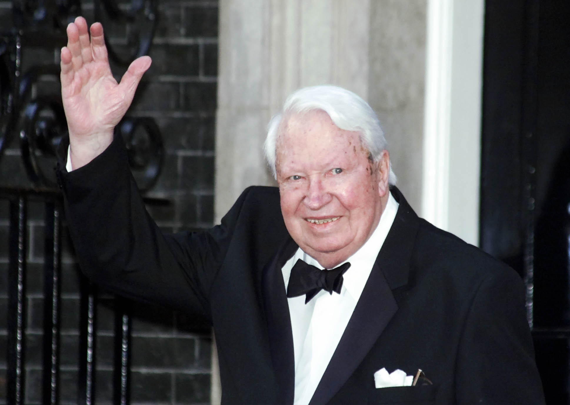 Britain's former Prime Minister Sir Edward Heath arrives at 10 Downing Street, in London Monday, April 29, 2002, where Prime Minister Tony Blair was hosting a celebratory royal Golden Jubilee dinner. Britain's Queen Elizabeth II, the Duke of Edinburgh and four former Prime Ministers were attending along with the relatives of five other prime ministers who held power during the Queen's 50-year reign but have since died. (AP Photo/Max Nash)
