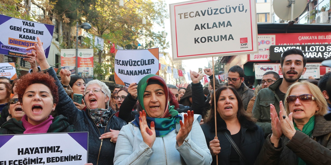 Turkish women stage a protest in Ankara on November 19, 2016 after a government legislation proposal that would overturn men's convictions for child sex assault if they married their victim. The bill provoked fury on November 19, with critics accusing the government of encouraging rape of minors with the proposals. Placards read: "Rape cannot be pardonned!"   / AFP PHOTO / ADEM ALTAN